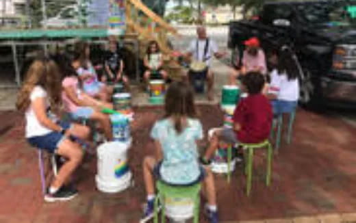 a group of people sitting at a table with drinks