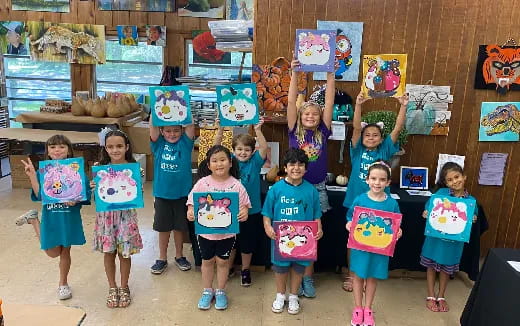 a group of children holding signs