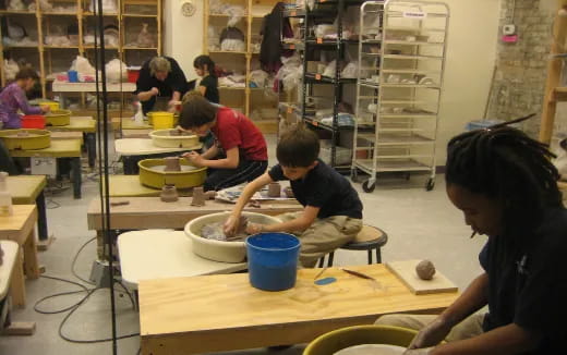 a group of people working in a workshop