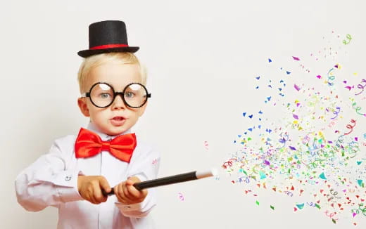a boy wearing a hat and glasses