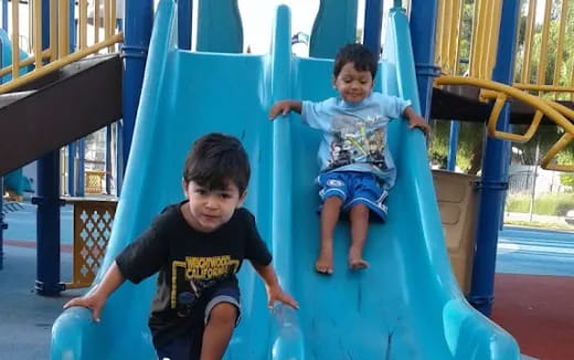 a couple of kids on a playground