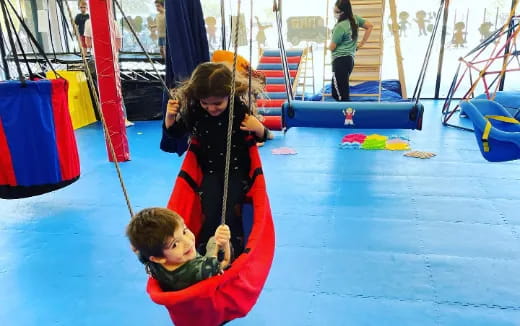 a person and a boy in a playground
