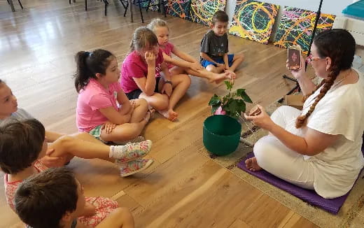 a group of people sitting on the floor