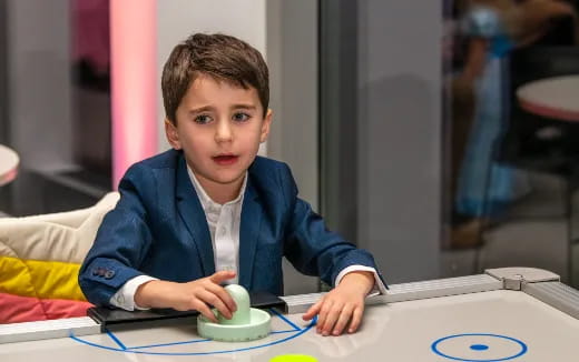 a boy sitting at a table