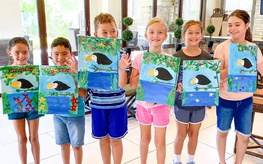 a group of children holding up signs