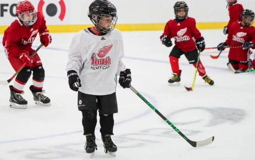 a group of people playing hockey