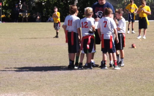 a group of boys in football uniforms
