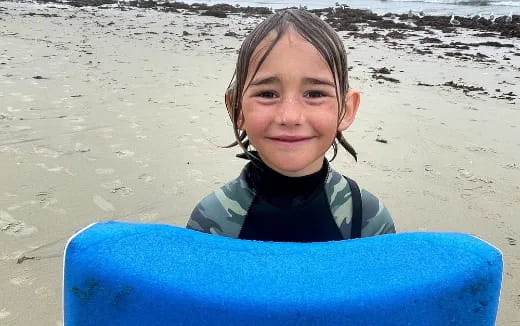 a girl smiling at the camera