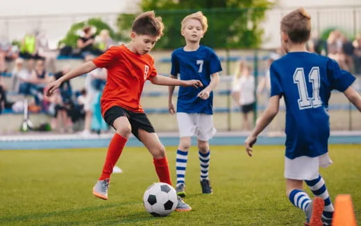 kids playing football on a field