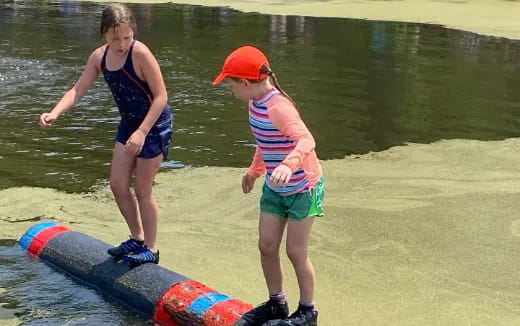 a couple of girls playing in the water