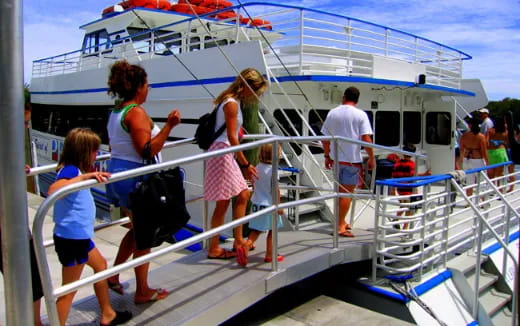 a group of people walking on a boat