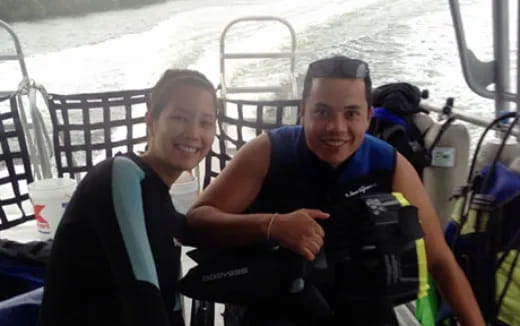 a man and woman on a boat