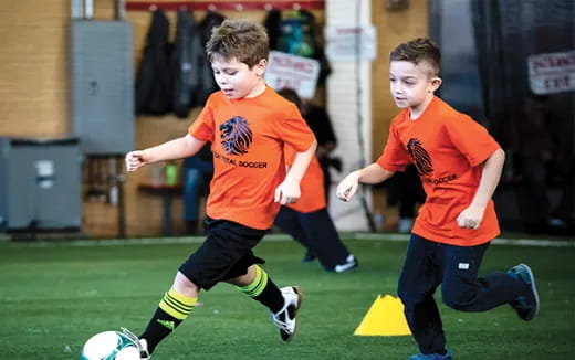 a group of boys playing football