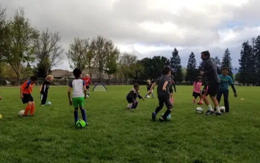 a group of kids playing football