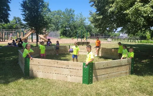 a group of kids playing in a playground