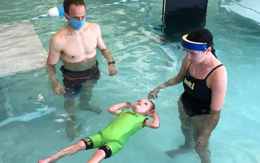 a group of people in a pool