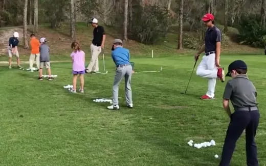 a group of people playing golf