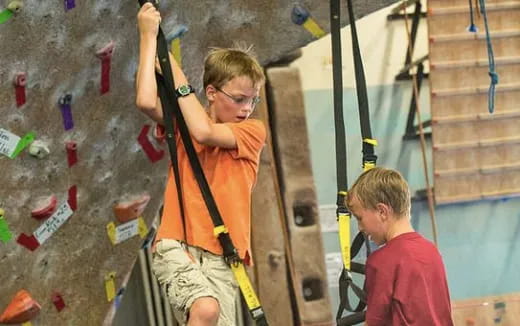 a man climbing a rock wall