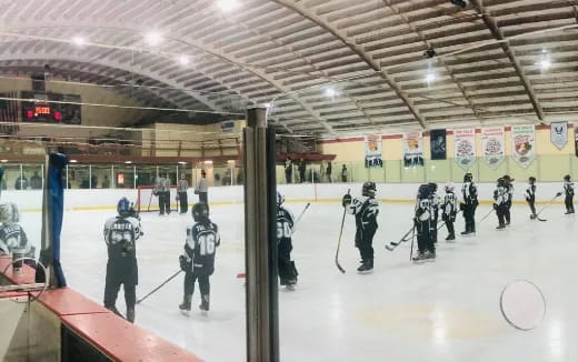 a group of people in a hockey rink