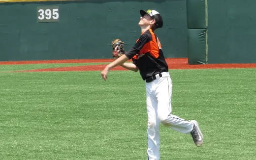 a baseball player throwing a ball