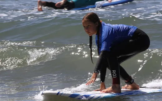 a person surfing on the waves