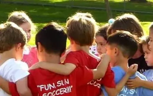 a group of people in red shirts