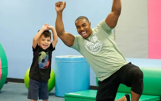 a person and a child on a playground slide