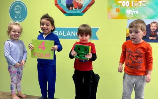 a group of children holding toys