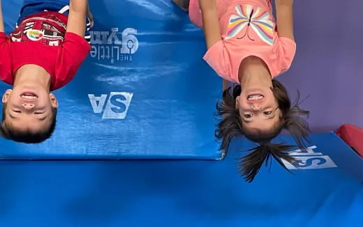 a man and woman on a blue mat