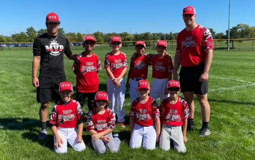 a group of kids in red uniforms