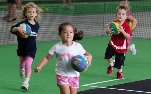 a group of young girls playing football