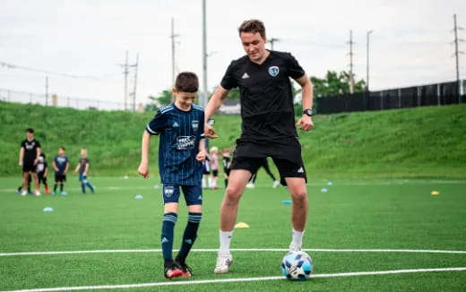 a couple of men playing football
