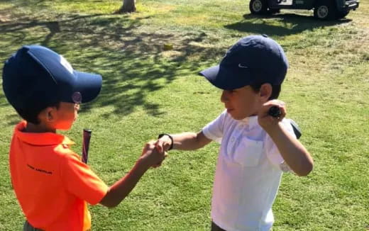 a couple of kids playing baseball