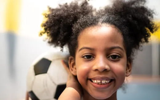 a close-up of a girl smiling