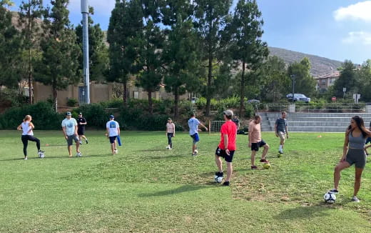 a group of people playing football