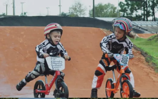 a couple of kids riding bikes