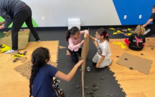 a group of children playing on the floor
