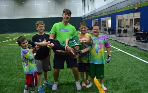 a group of people holding a trophy
