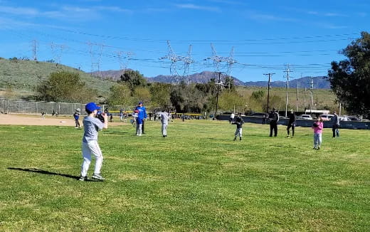 a group of people playing baseball