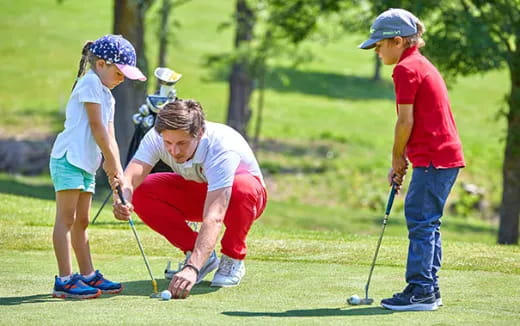 a group of people playing golf