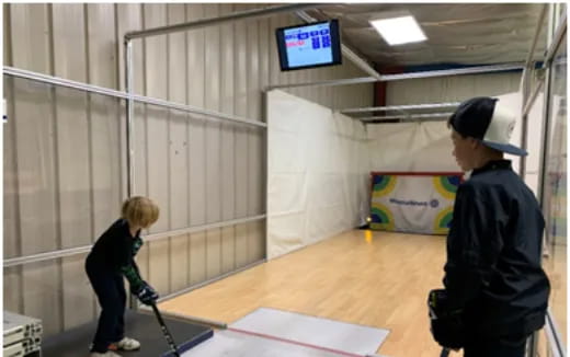 a couple of kids playing hockey