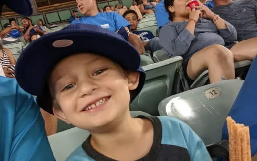 a boy smiling for the camera