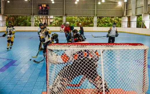 a group of people playing hockey