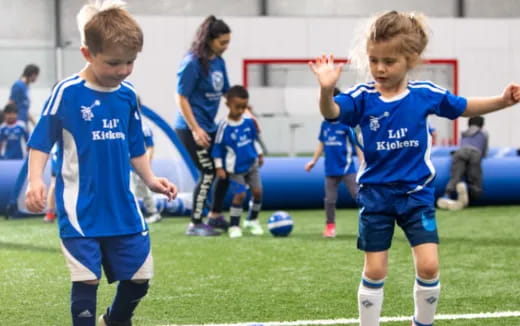 kids playing football on a field