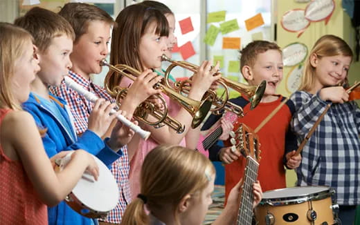 a group of kids playing instruments
