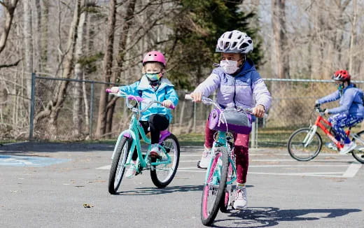 a group of kids riding bikes