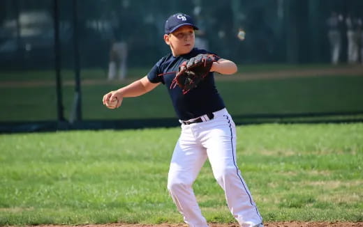 a baseball player throwing a ball