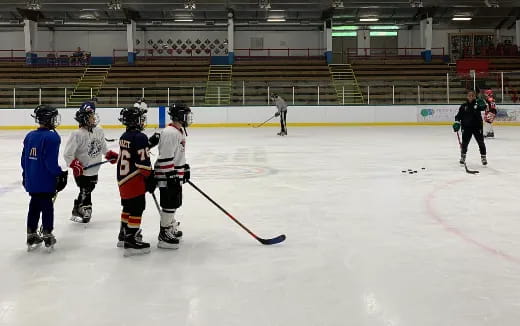 a group of people playing hockey