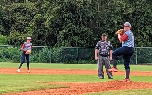 a group of men playing baseball