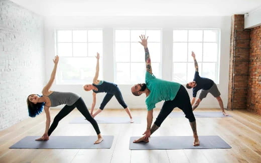 a group of people doing yoga